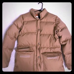 The North Face tan down coat.